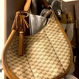 Brand new Michael kors hand or shoulder bag! Tan and brown perfect for fall!!